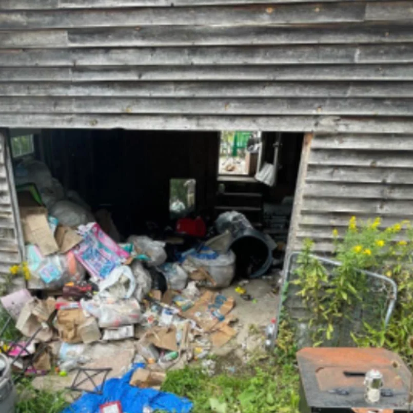 A house that has been demolished and is full of garbage.